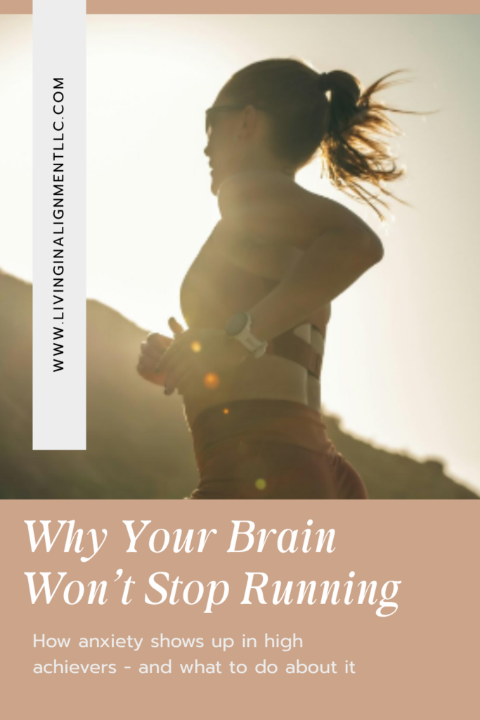 Woman running outdoors at sunrise with text overlay — "Why Your Brain Won't Stop Running: How anxiety shows up in high achievers" — by Stephanie Thomas, anxiety therapist for high achievers at Living in Alignment